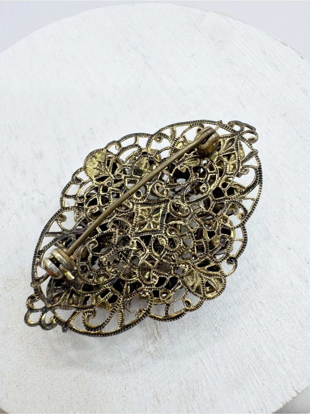 Antiqued gold tone filigree Czech style glass brooch pin